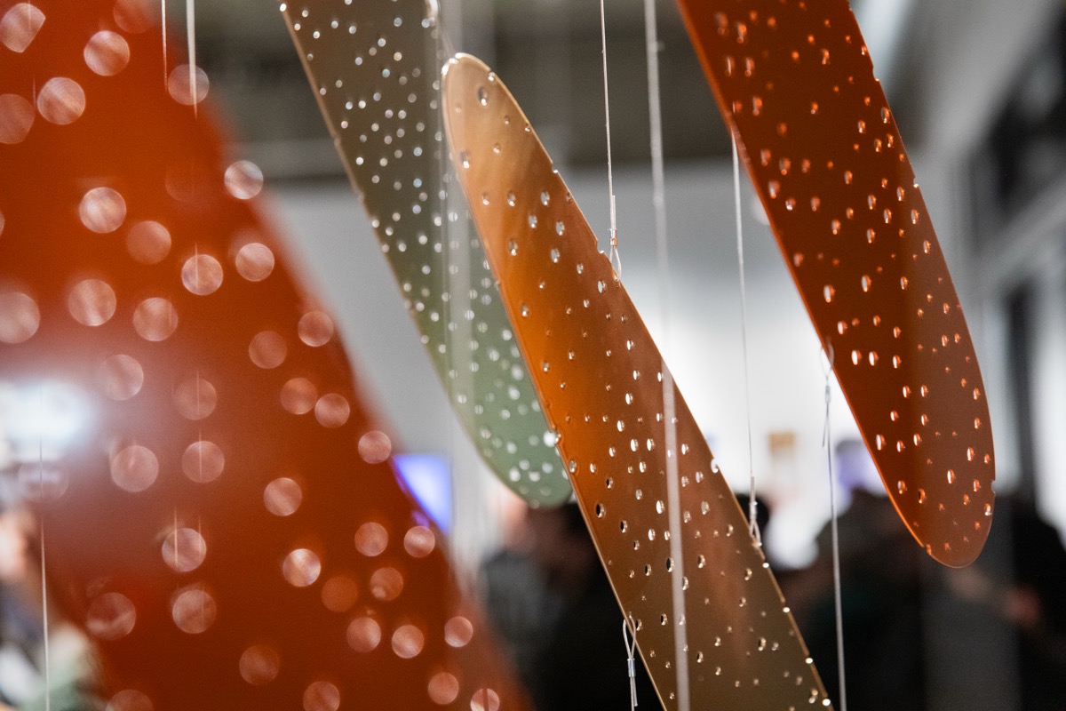 Visitors view works at the Metaxis opening